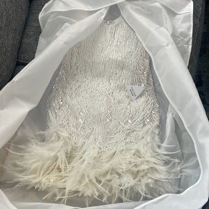 White cocktail /wedding Reception dress. White beaded and feather detailing.
